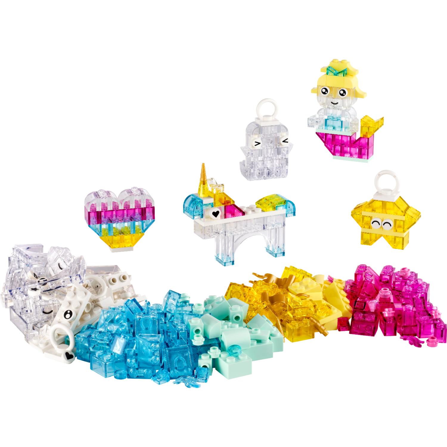 Erilaisia LEGO DOTS -palikoita, mukaan lukien merenneitohahmo, yksisarvinen, sydän, tähti ja kasoittain värikkäitä läpikuultavia palikoita.