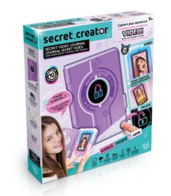 ”Secret Creator Secret Video Journal” -pakkaus, jossa on violetti elektroninen päiväkirja, jossa on lukkosymboli, kuvia sitä käyttävästä tytöstä sekä tekstiä, jossa korostetaan ominaisuuksia kuten video, lukituksen avaaminen, tallennus ja tallentaminen. Ikäsuositus: 7 vuotta ja ylöspäin.