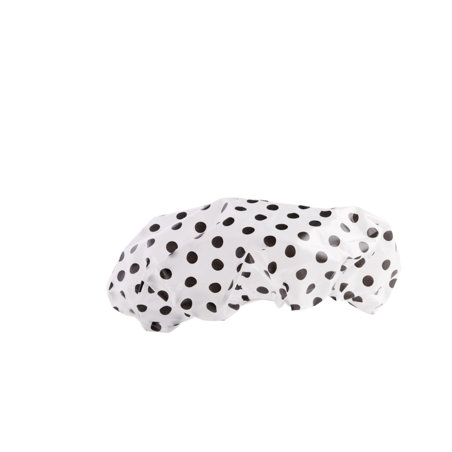 Suihkumyssy pilkullinen: valkoinen suihkumyssy, jossa on mustia pilkkuja.